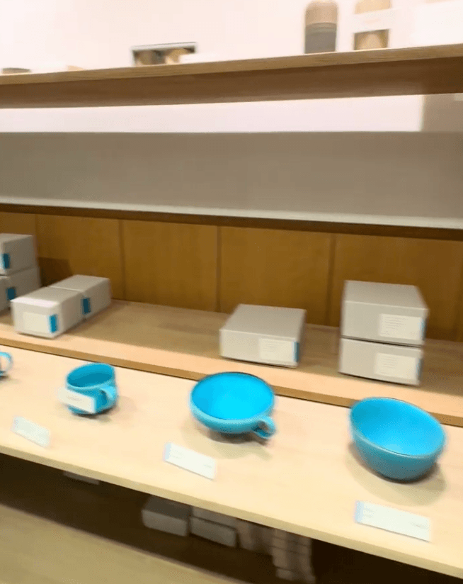Finished greenware pieces drying on a studio shelf