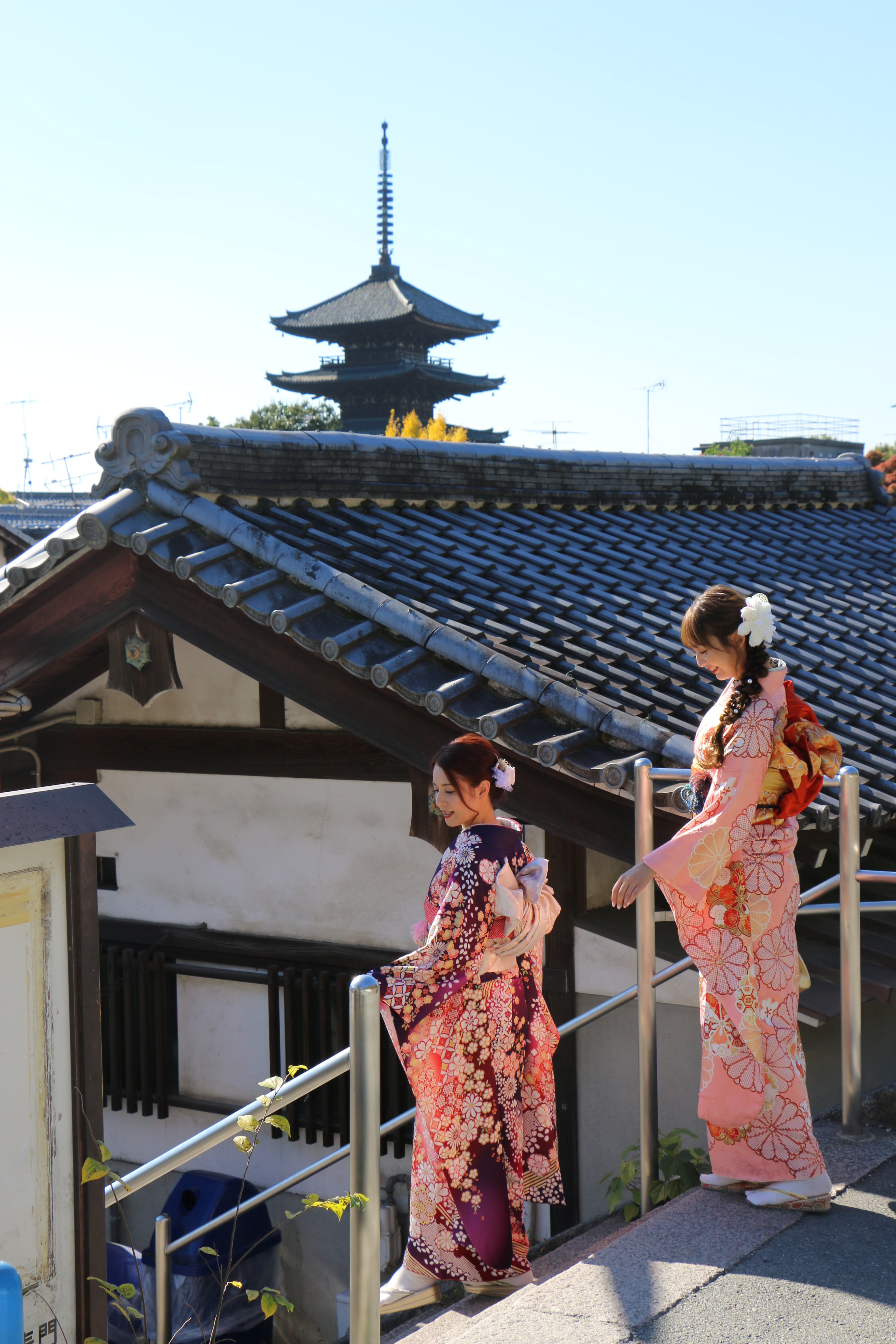 Two guests strolling in seasonal kimono
