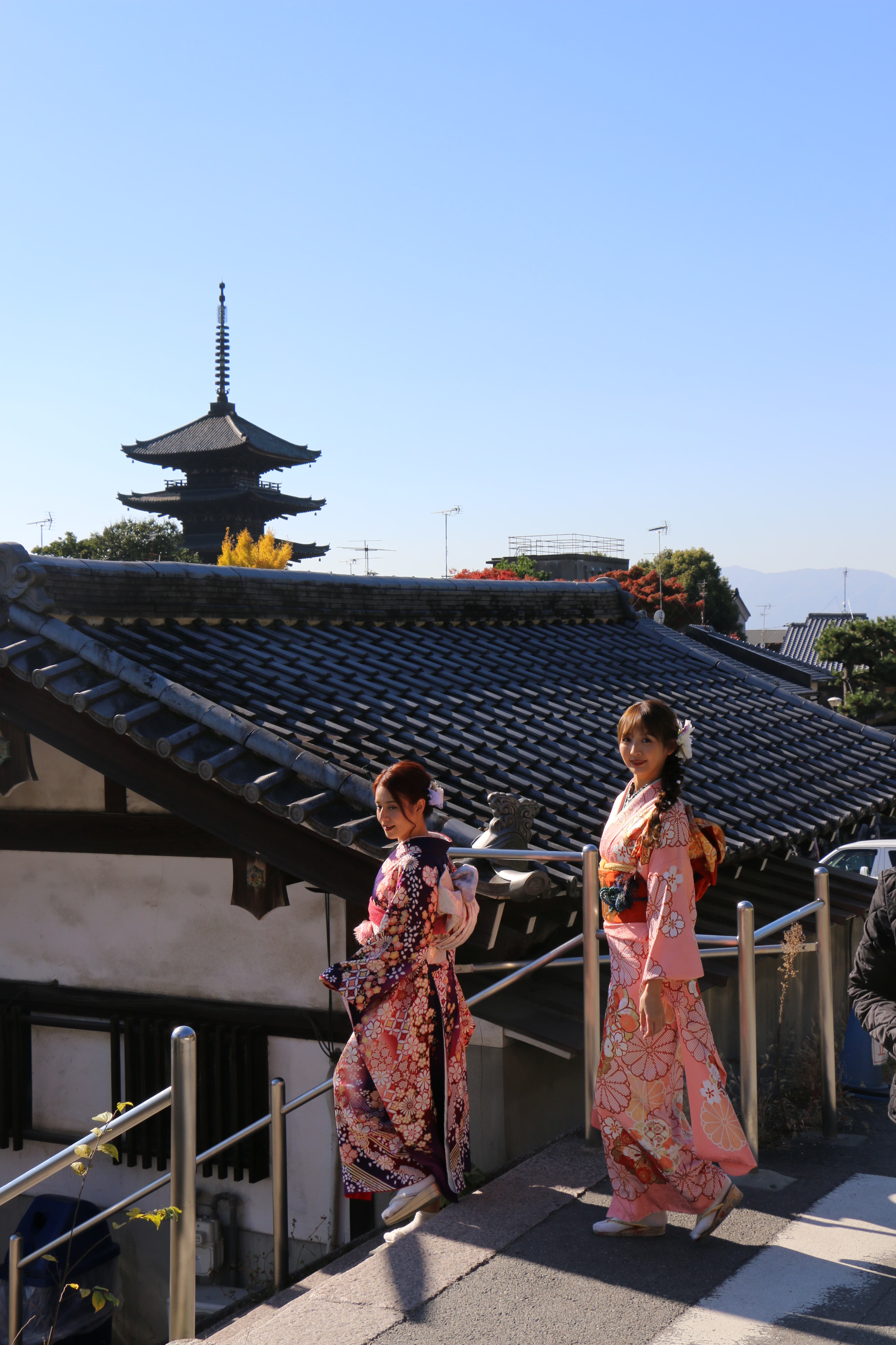 Two ladies in kimono at a scenic Kyoto spot
