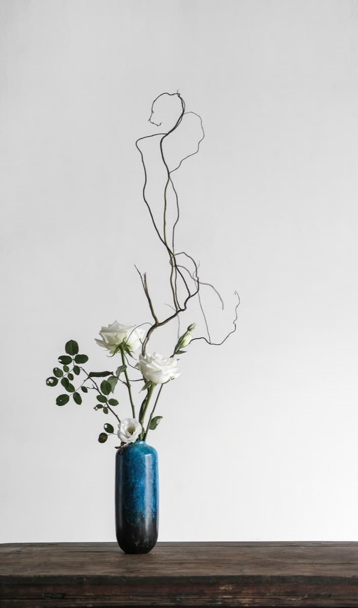 Close-up of ikebana in a traditional ceramic vessel